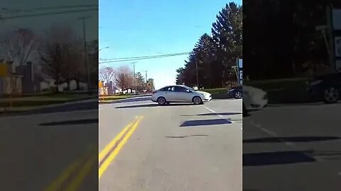 Even dressed completely in orange, driver still pulls out in front of Motorcycle rider.