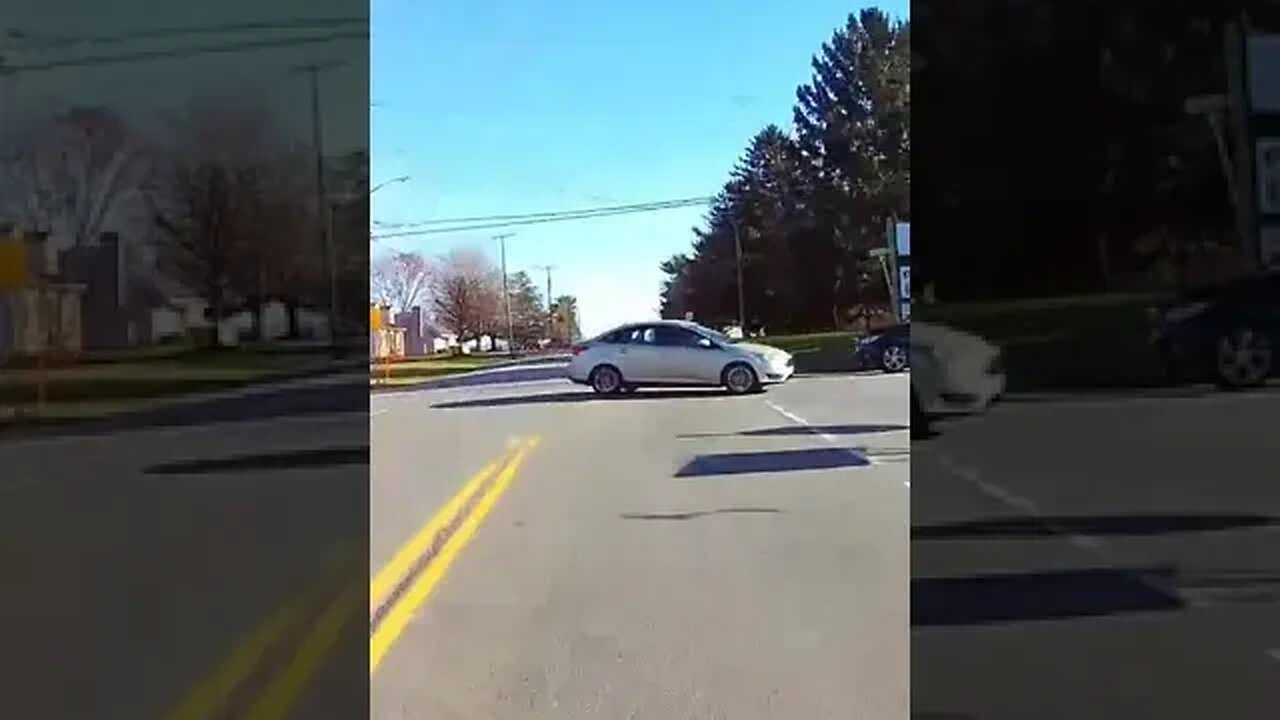Even dressed completely in orange, driver still pulls out in front of Motorcycle rider.