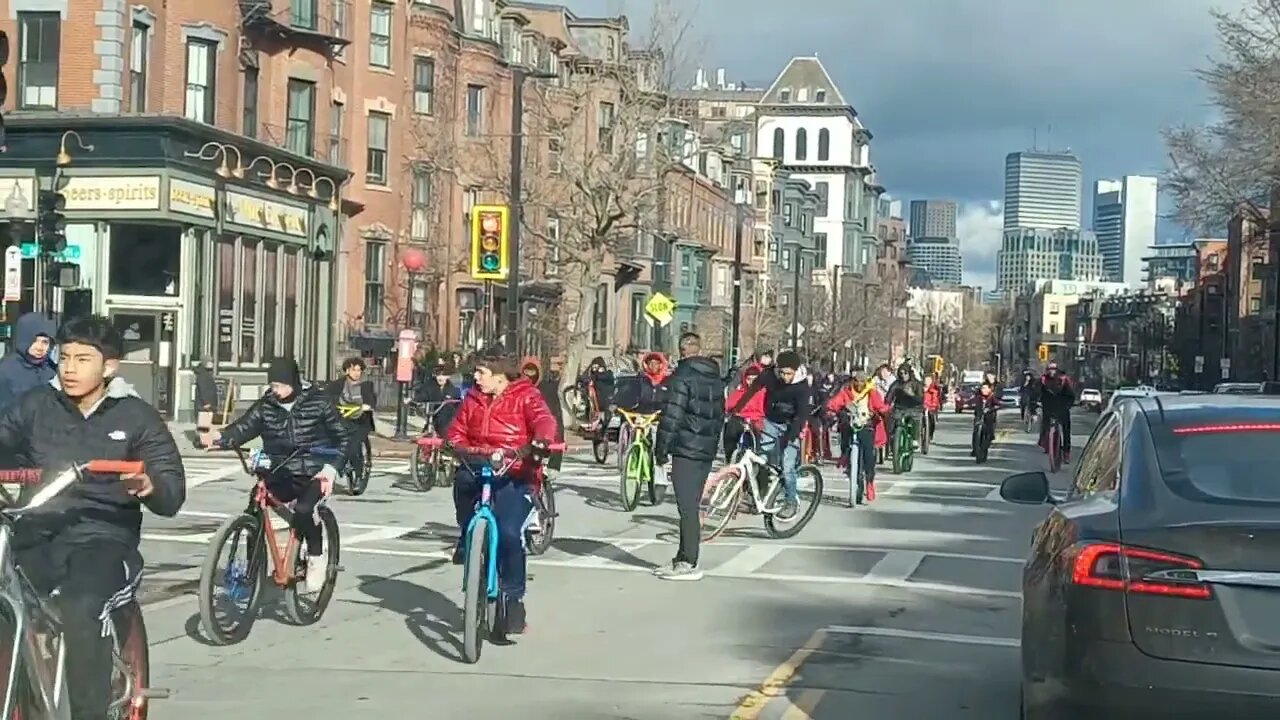 a group of bikes riding down Tremont Street