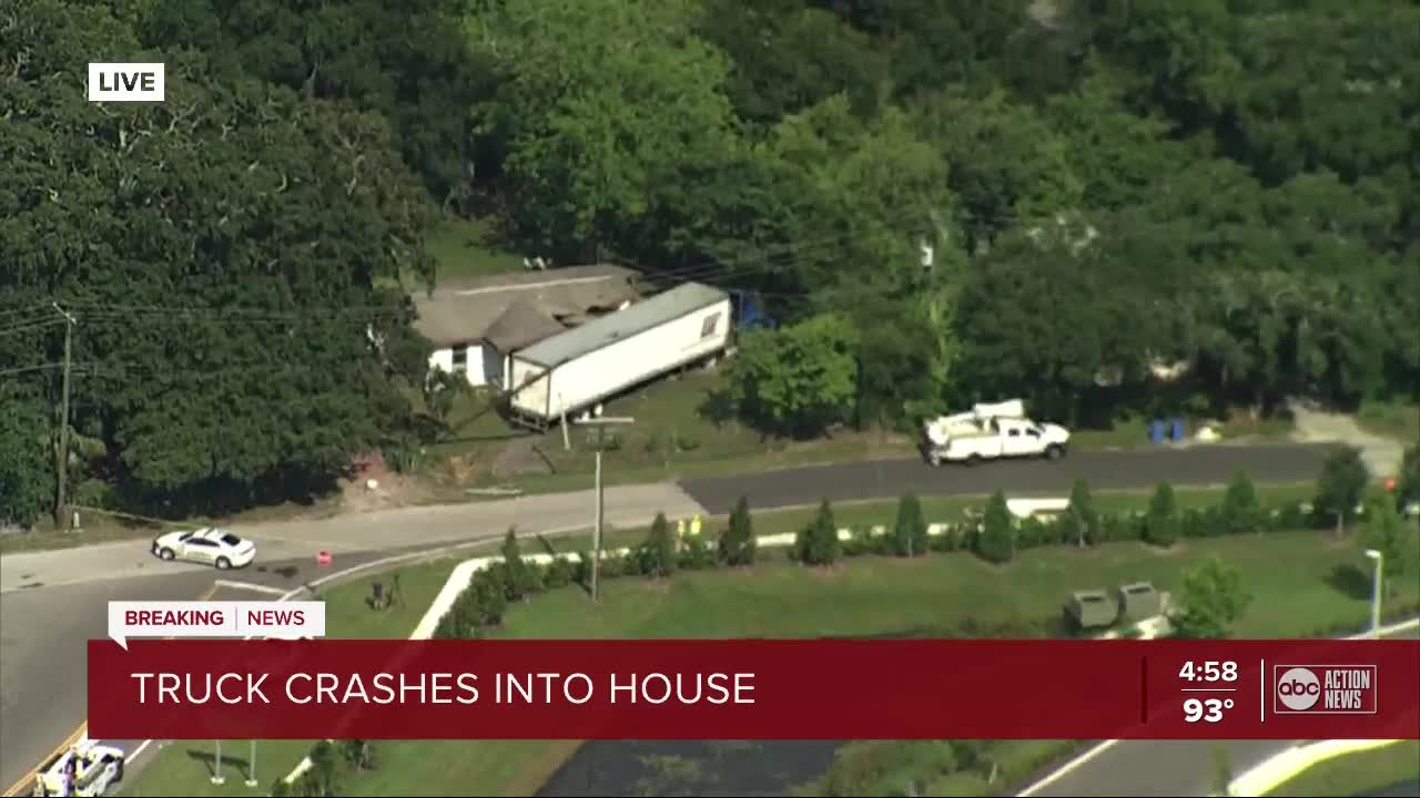 Semi-truck crashes into side of a house in Tampa