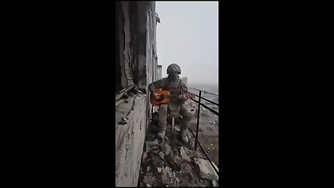 The Russian soldier drops his gun and grabs a guitar