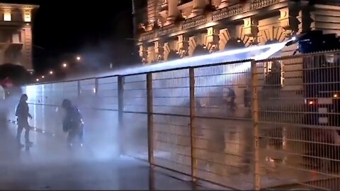 Swiss - Bern - People being hit by water jacts