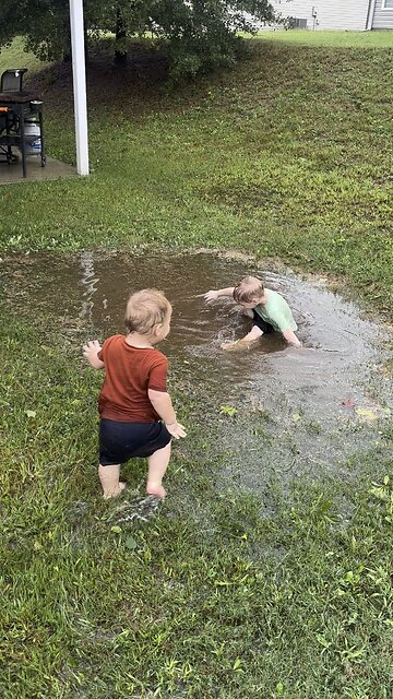 Boys playing in Hurricane Helene