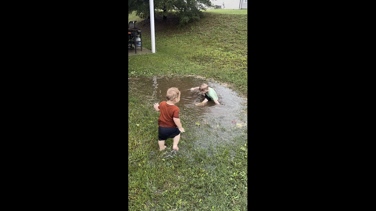 Boys playing in Hurricane Helene