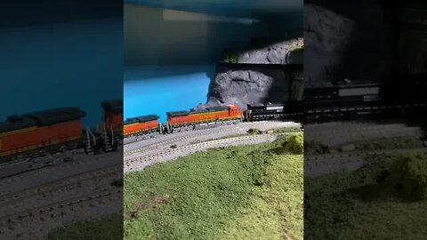 N Scale BNSF train struggles out of a tunnel