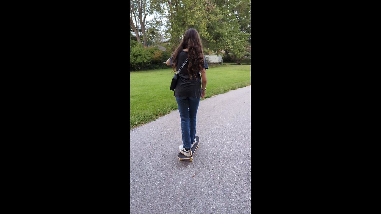 Victoria skateboarding in KC park