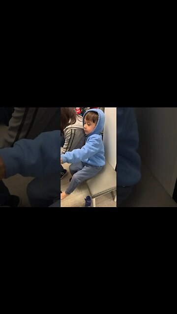 Baby boy is happy as he has new shoes bought