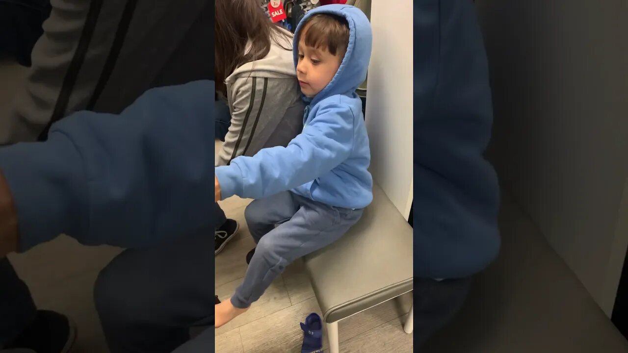 Baby boy is happy as he has new shoes bought