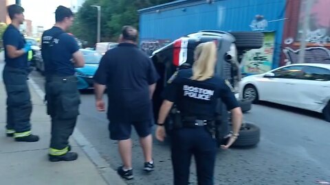 Boston police investigate a car rollover on Terrace Street