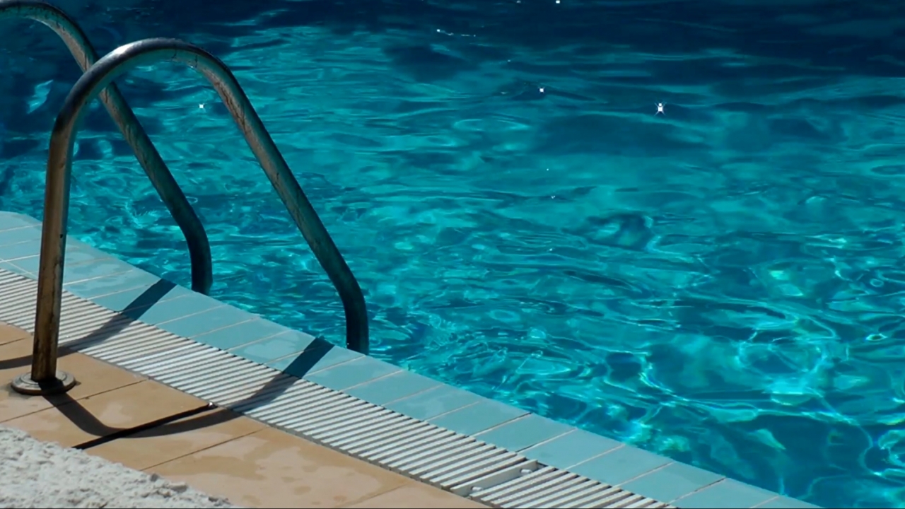 What's The Risk Of Getting COVID-19 From Having People Over To Swim?