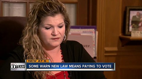 Some warn new law means paying to vote