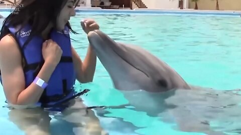 -Beautiful woman Kisses Dolphin/Shenanigan's-