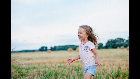 Cute child eating a banana from a funny