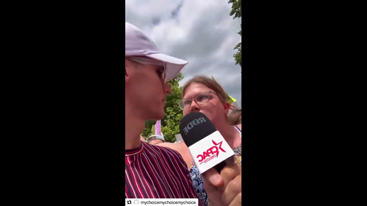 An unhinged white liberal woman loudly chants her pro-abortion stance at a rally