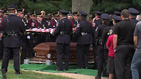 The flag folding ceremony at Lt. Aaron Allan's funeral