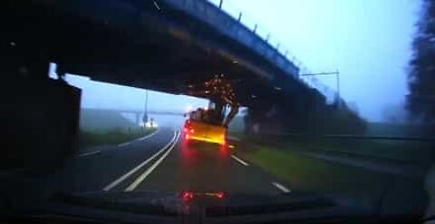 Tractor crashes violently against bridge