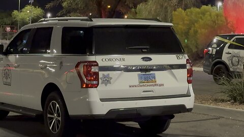 Las Vegas coroner removes deceased from behind gas station