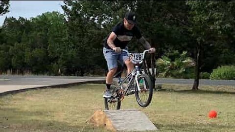 Man fails bicycle jump in style