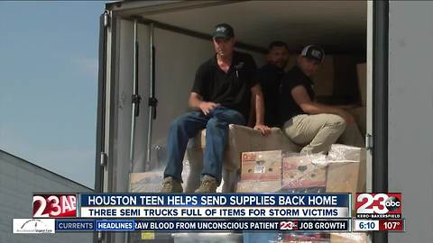 Volunteers fill semi trucks full of items for Harvey victims