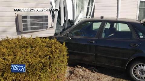 Car crashes into apartment building