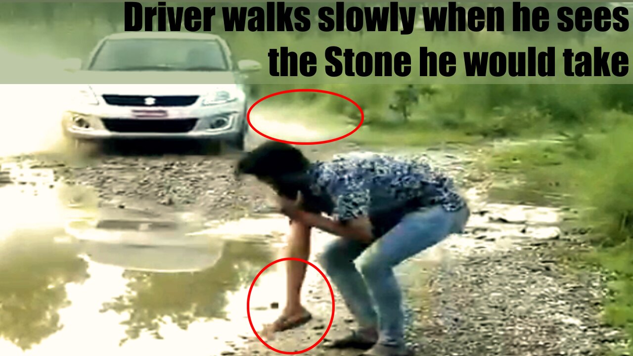 Driver Walks Slowly When He Sees The Stone He Would Take.