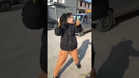 Chinese Village Girl Plays Her Cymbals