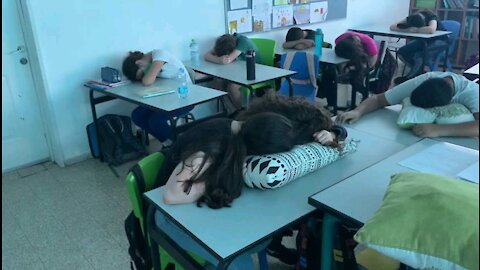 Children sleep in class at school