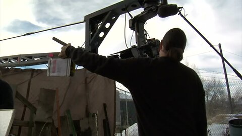 action and camera rises on crane into cloudy sky SBV 300151020 HD