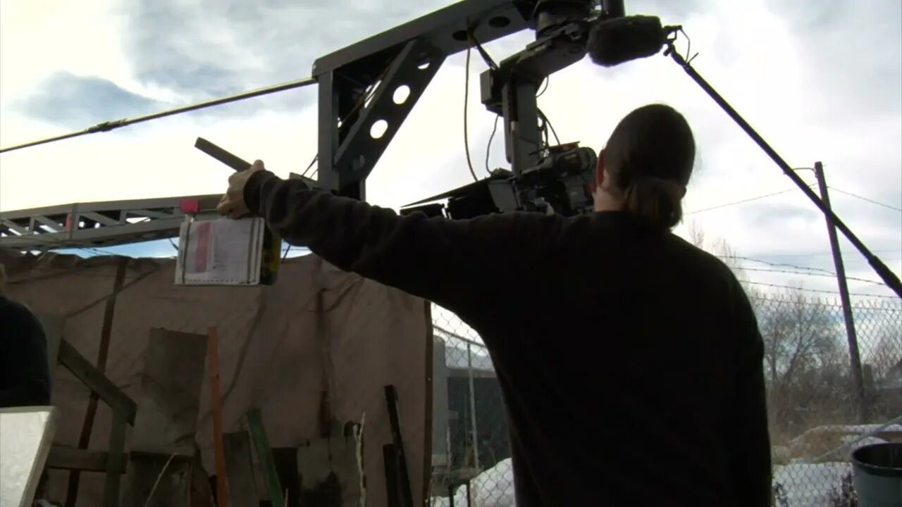 action and camera rises on crane into cloudy sky SBV 300151020 HD
