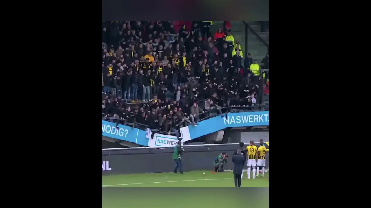 Vitesse fans stand collapsed but they cheer on