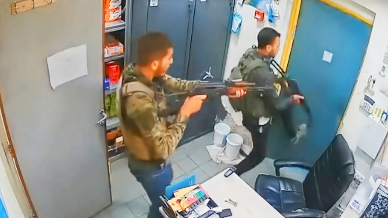 Two Israeli shopkeepers escape Hamas attack by hiding in freezer.