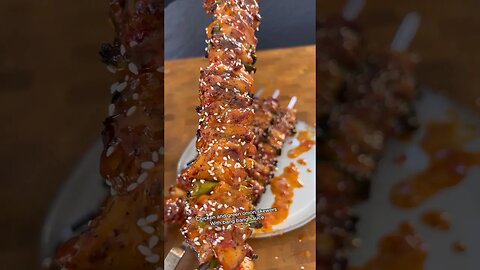 Chicken and green onion on skewers with bang bang sauce