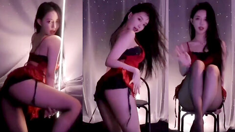 Hot dance streamer in red lace sleepwear and form-fitting shorts showcases her curves and long legs in a seductive dance