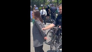 AOC Pretends To Be Handcuffed Outside Supreme Court