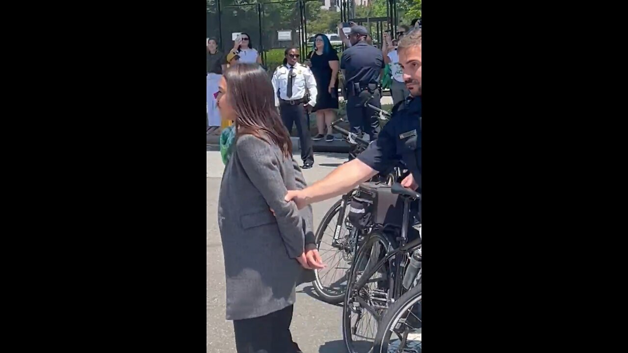 AOC Pretends To Be Handcuffed Outside Supreme Court