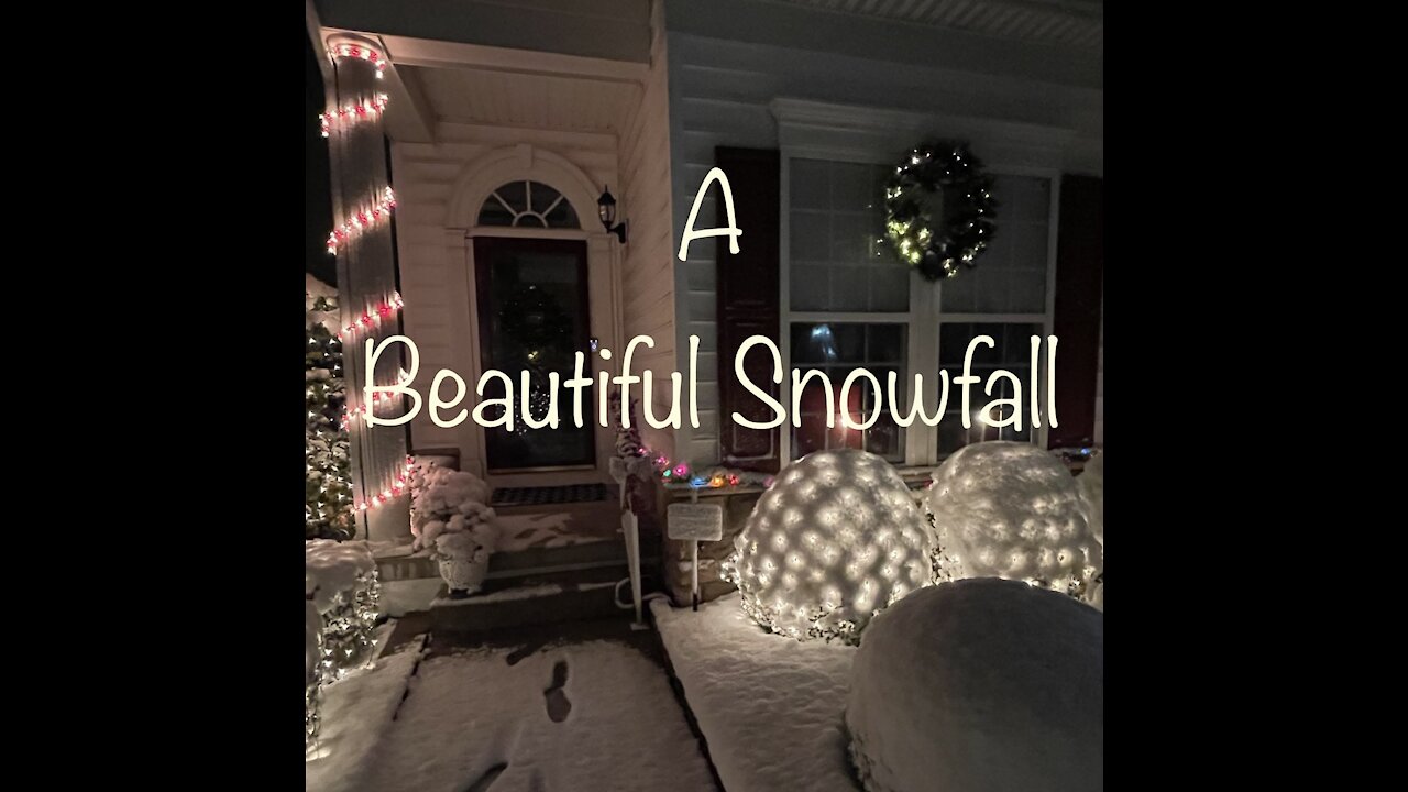 A Beautiful Snowfall With Lights All A Glow