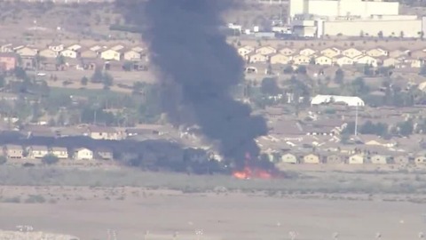 Henderson firefighters battling brush fire