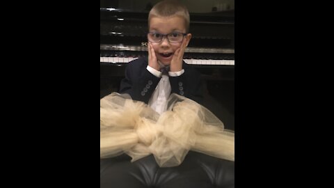 Gifted child plays Of the Fathers Love Begotten