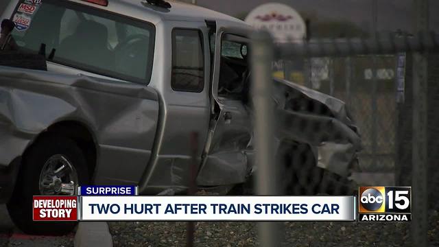 Two hurt after train strikes truck in Surprise