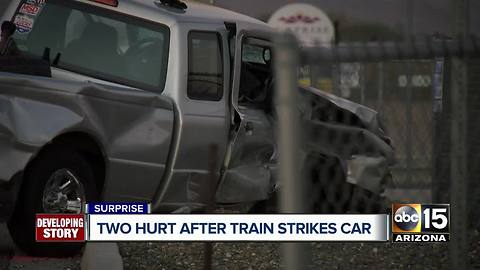 Two hurt after train strikes truck in Surprise