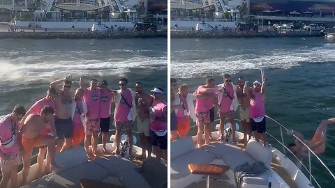 Man slips hilariously on boat's fence and falls into water
