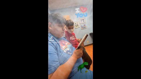 Native family reading together