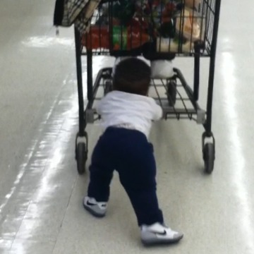 Toddler Pushes His Dad In A Shopping Cart