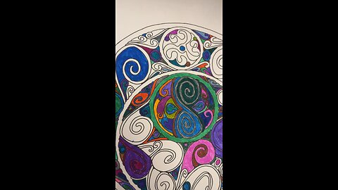 Coloring in a Mandala coloring book page