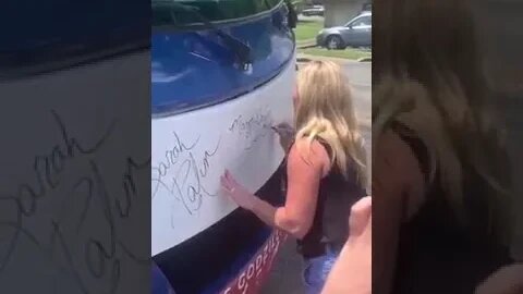 TEAM TRUMP GA BUS TOUR - Marjorie Taylor Greene signs the bus 5/22 Veterans For America First