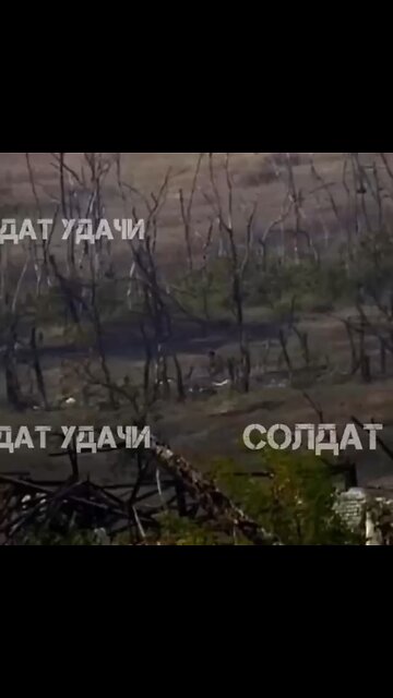 Ukrainian solider try to hit a Russian drone by swinging his rifle…