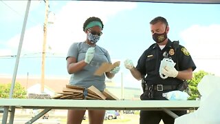 Norwood neighbor teams up with police department to hand out face masks