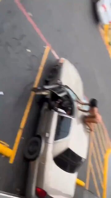 Woman Destroys Boyfriend’s Car with Him In It