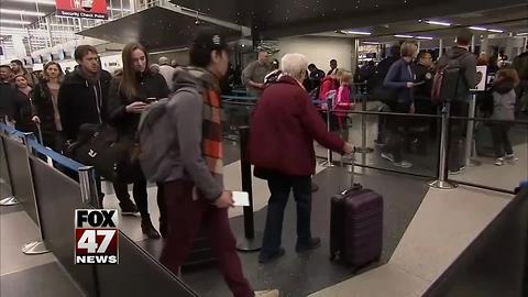 Travelers return home after holiday vacation