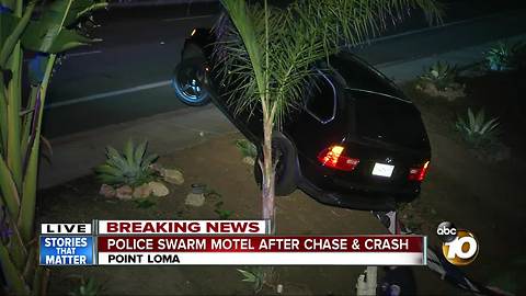 Police swarm motel after chase, crash